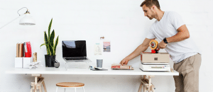 Man packing boxes at desk