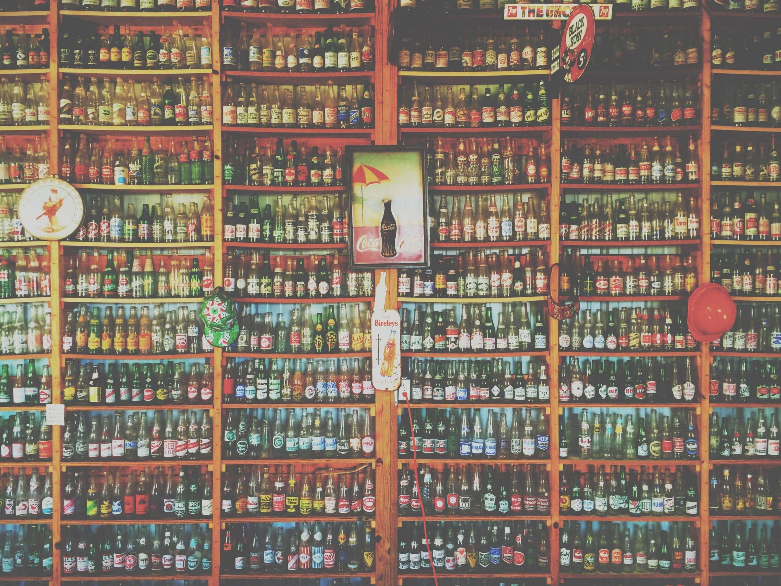 A bar shelf stacked with bottles