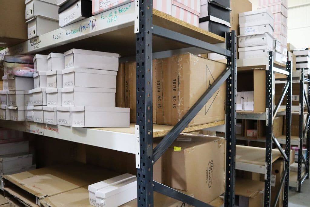 Self storage facility shelving units stacked with boxes Newmarket