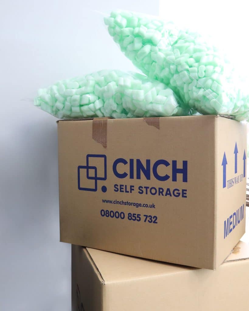 Cinch Self Storage packaging materials next to stack of boxes