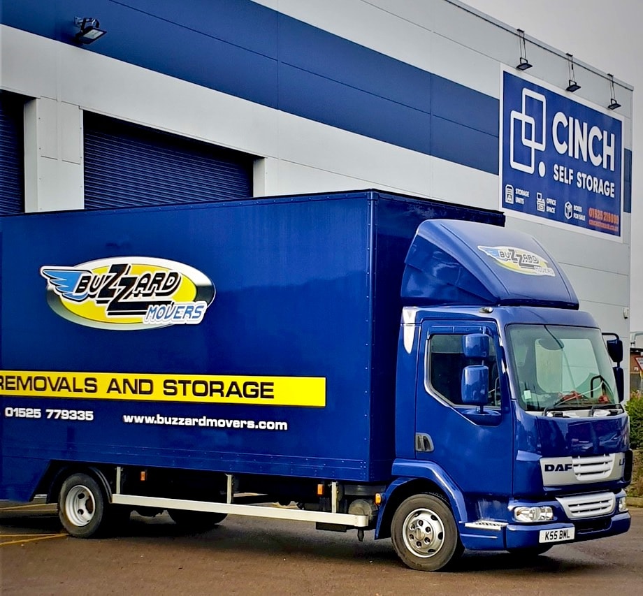 Buzzard Movers Van outside Cinch Storage Facility