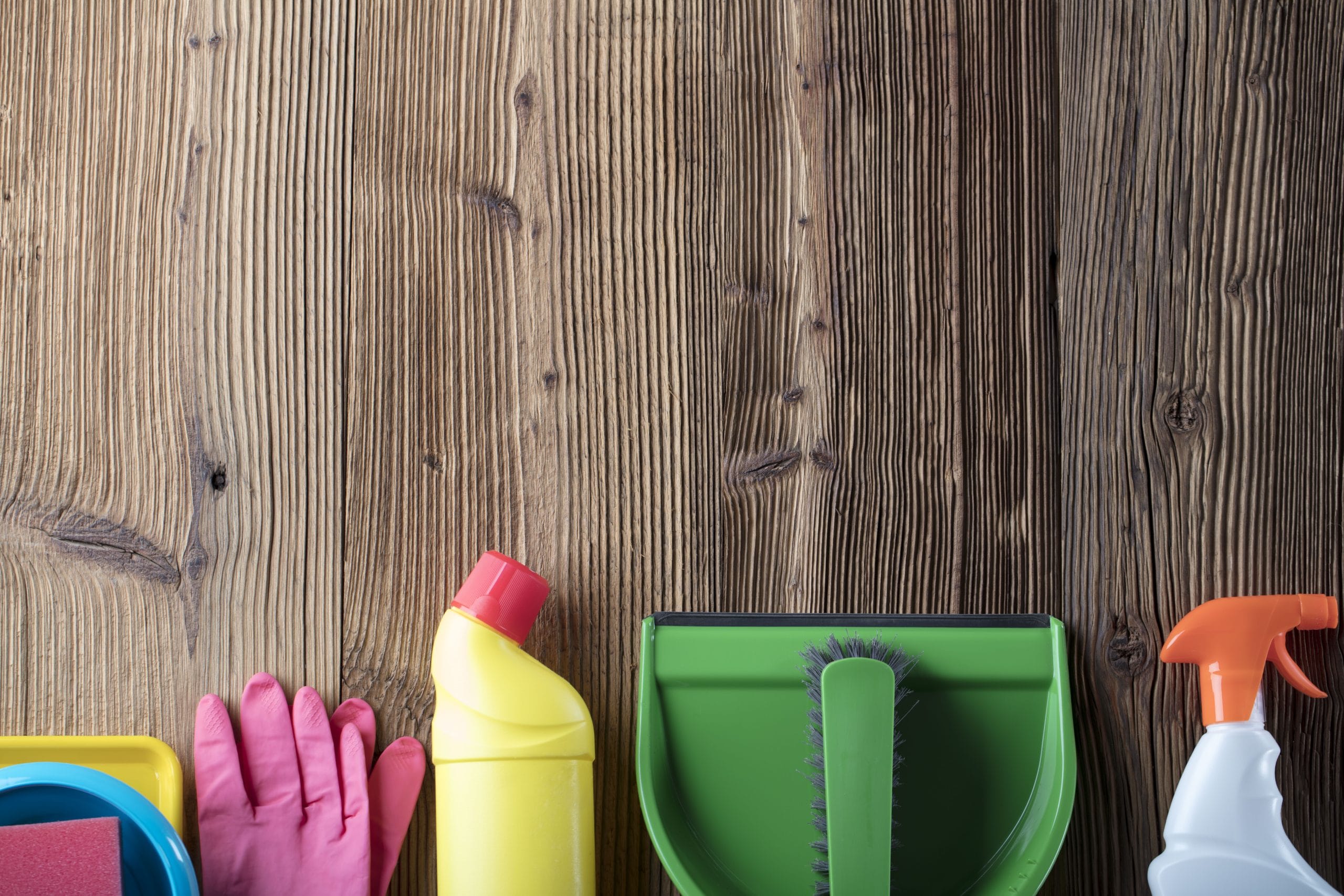 Cleaning products lined up against wood panels for Self Storage Ely