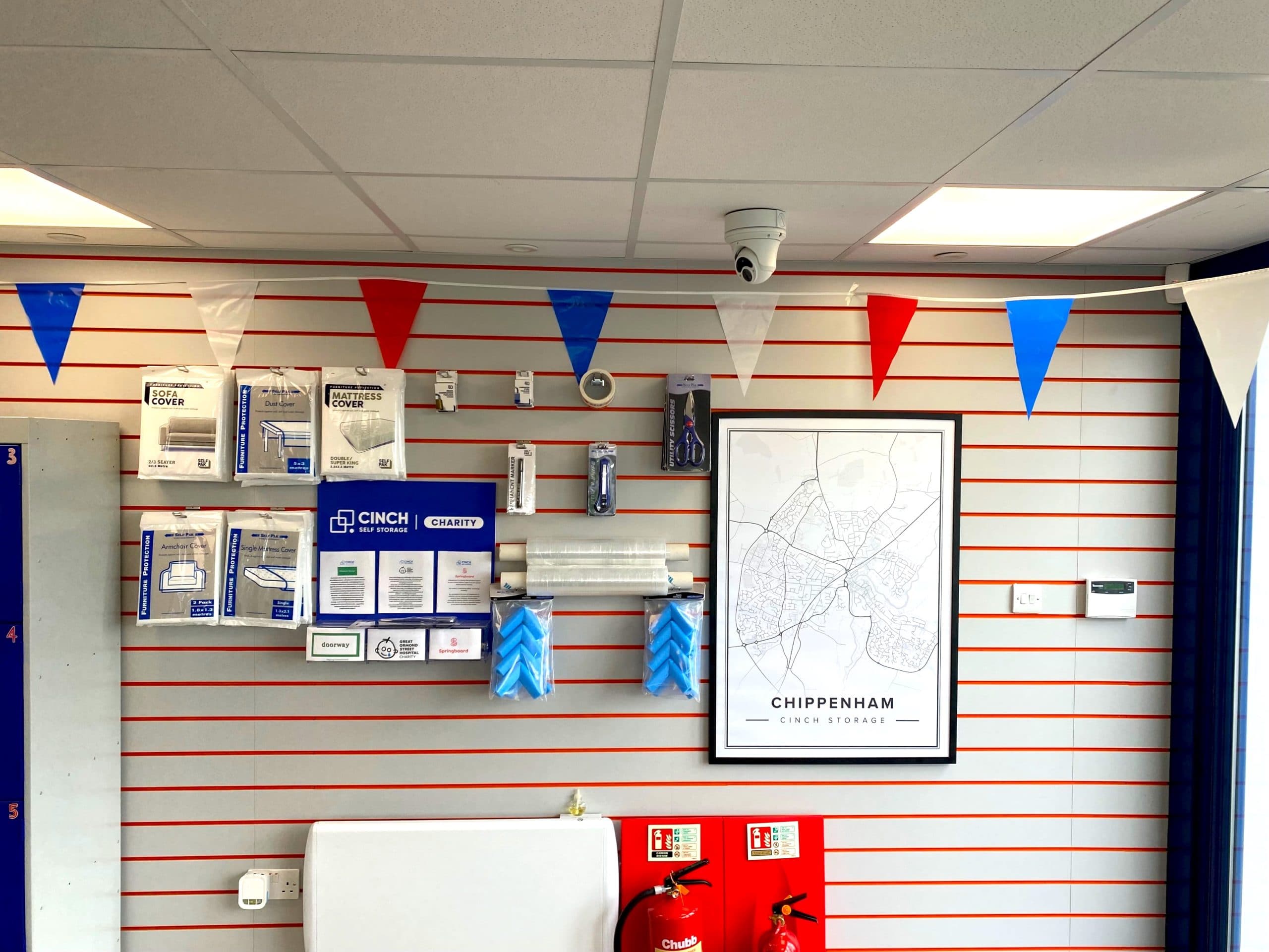 Red, white and blue bunting hanging across a wall in Cinch Storage Chippenham