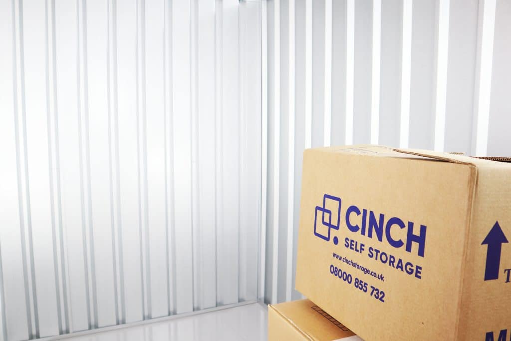 Storage units in Earlsfield: What we have on offer. Image shows interior of a storage unit with cinch storage cardboard boxes stacked on top of eachother