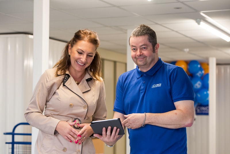 What questions to ask when looking into storage facilities in Hove. Image shows a Cinch storage team member helping a customer answer questions. 