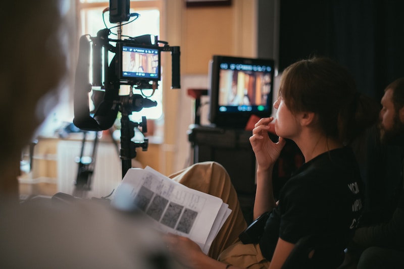 Storage unit to rent Sittingbourne. Image shows director looking at the screens on set