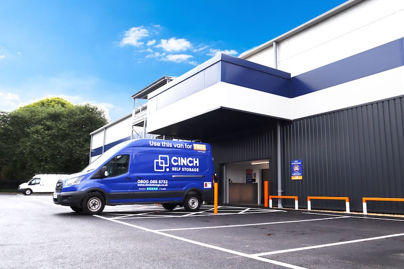 Self storage in Newbury. Image shows the exterior of the Cinch Self Storage Newbury facility with a blue Cinch Self Storage van parked outside. 