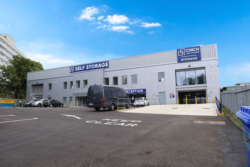 Self storage in Brentwood. Image shows the exterior of the Cinch Self Storage in Brentwood with a black van parked outside. 