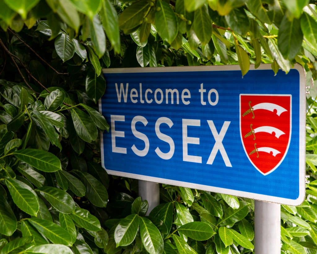 Is Brentwood a nice place? 5 Reasons to move. Image shows a blue 'Welcome to Essex' sign nestled in some green leaves. 