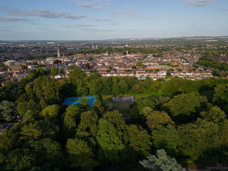 Best areas to live in Swindon. Image shows panoramic view of Swindon old town with church and residential houses.