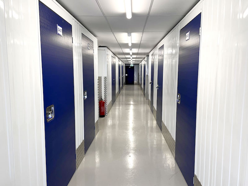 5 facts about Chippenham. Image shows storage unit corridor with blue doors.