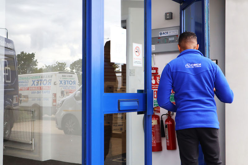 Mitcham short term storage. Image shows Cinch storage employee entering Cinch Storage Mitcham.