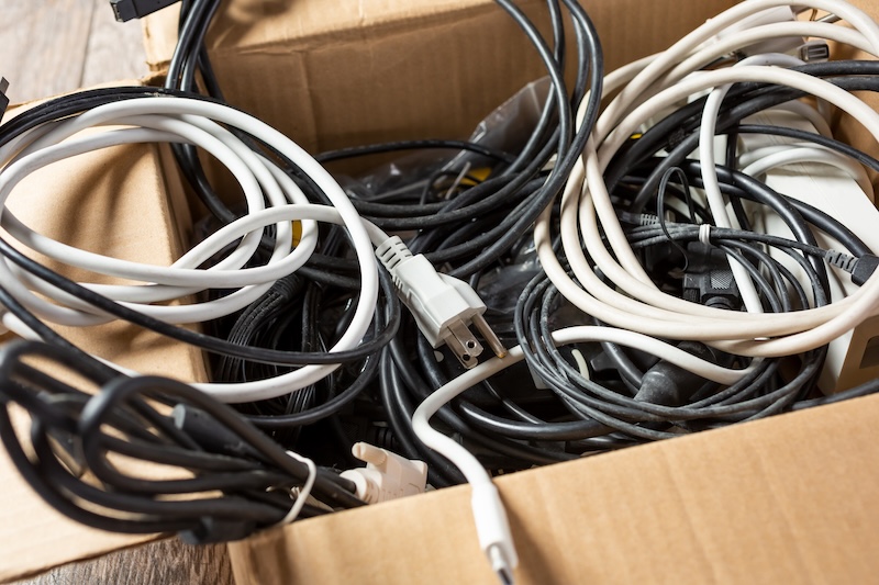 Storage Wisbech. Image shows a view of a cardboard box full of computer and electronic cables.